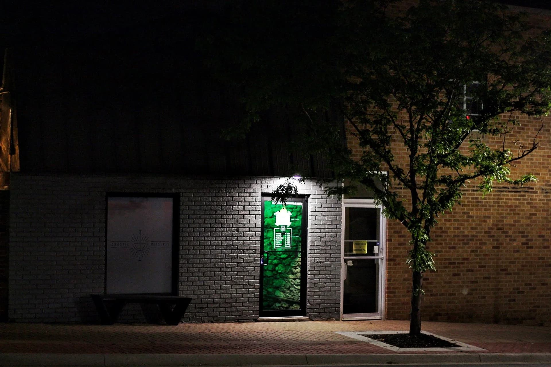 Front entrance of cocktail bar at night